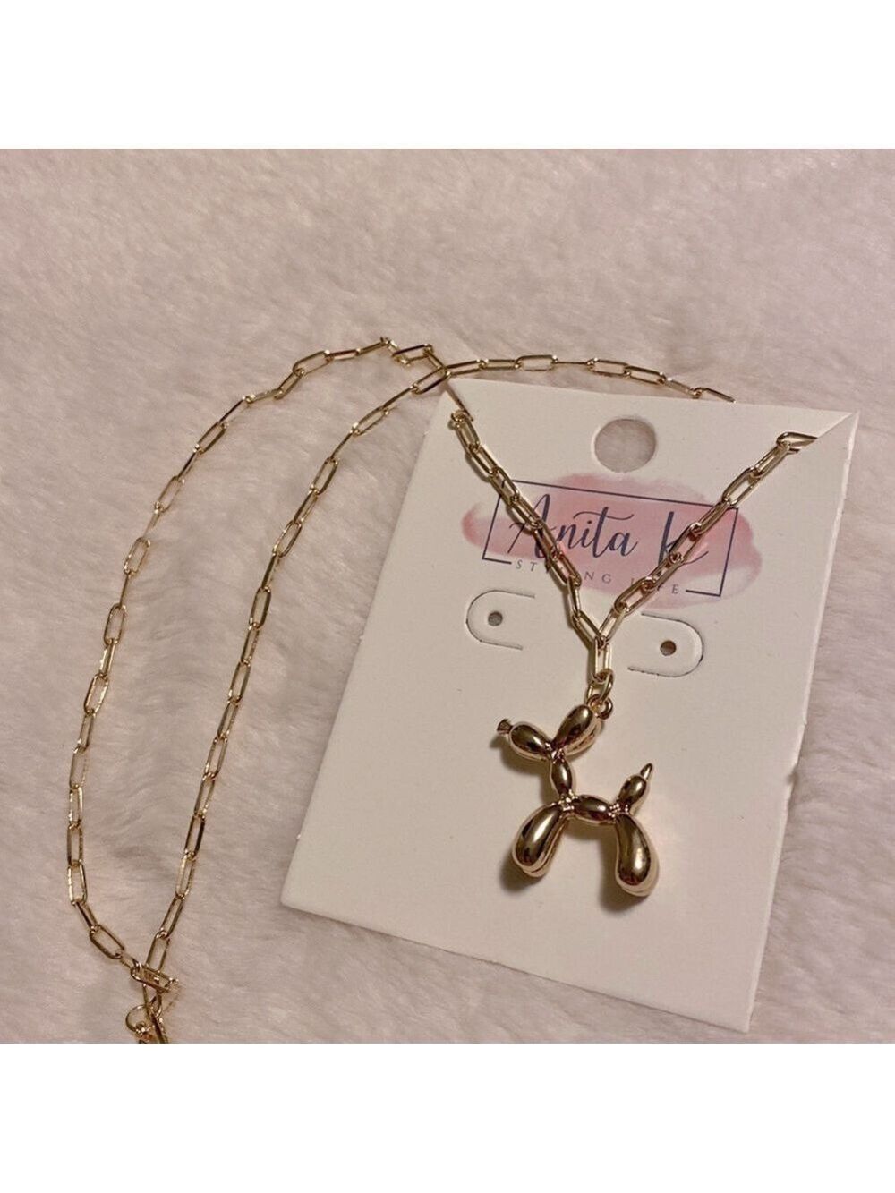 Paperclip chain with Balloon dog gold pendant.